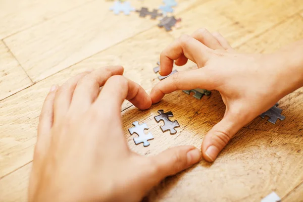 Little kid playing with puzzles