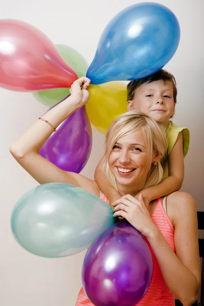 Pretty real family with color balloons