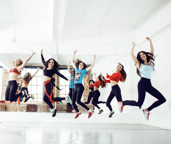Women doing sport in gym, healthcare lifestyle people concept, modern loft studio