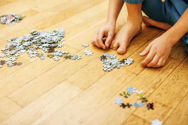 Little kid playing with puzzles