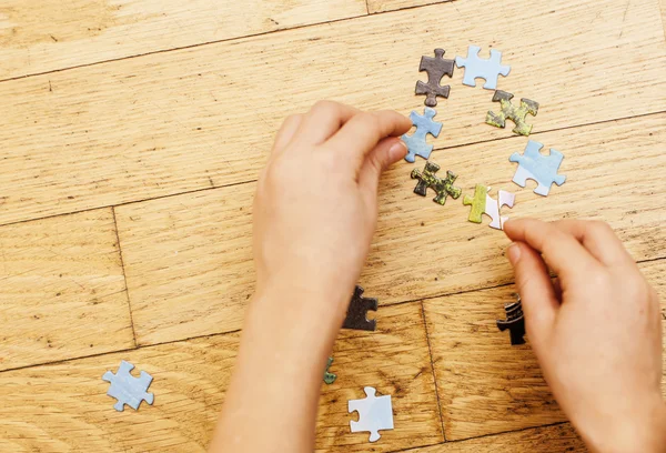 Little kid playing with puzzles