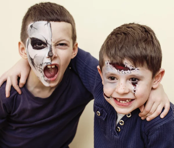 Zombie apocalypse kids concept. Birthday party celebration facepaint on children dead bride, scar face, skeleton together
