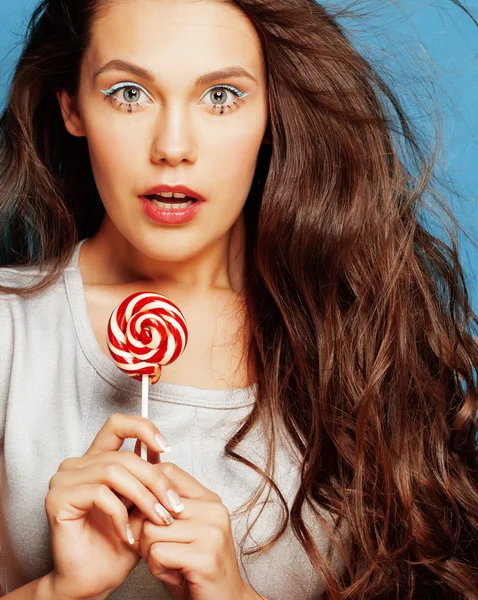 Young pretty adorable woman with candy close up like doll