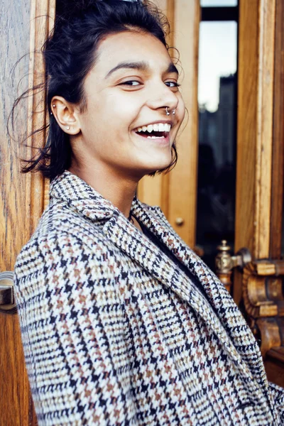 Young pretty student teenage indian girl in doors happy smiling, having fun, lifestyle people concept