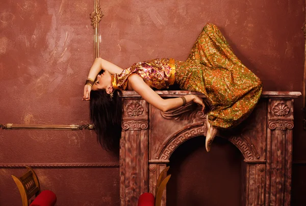 Beauty sensual young woman in oriental style, luxury room