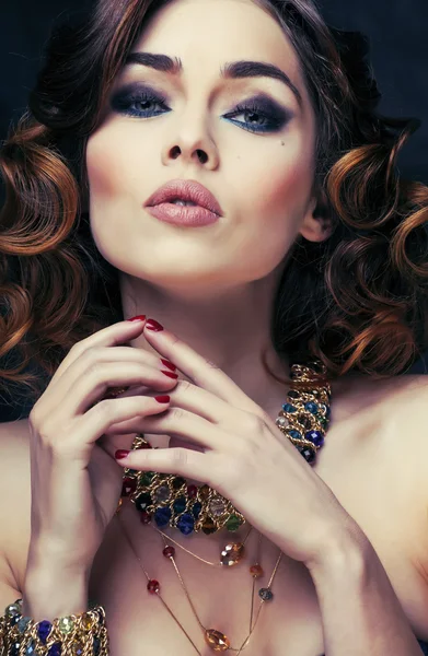 Beauty rich woman with luxury jewellery close up