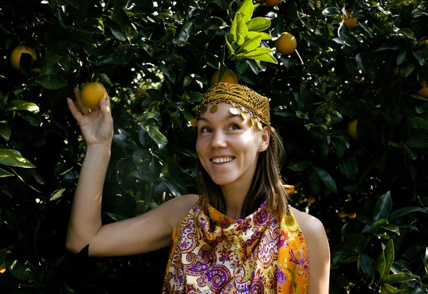 Pretty islam woman in orange grove smiling