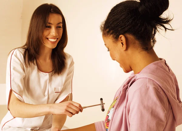 Young smiling doctor examine patient, measuring pressure