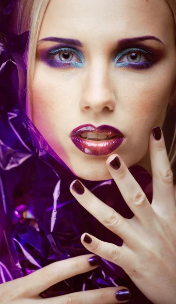 Beauty woman with creative make up, many fingers on face