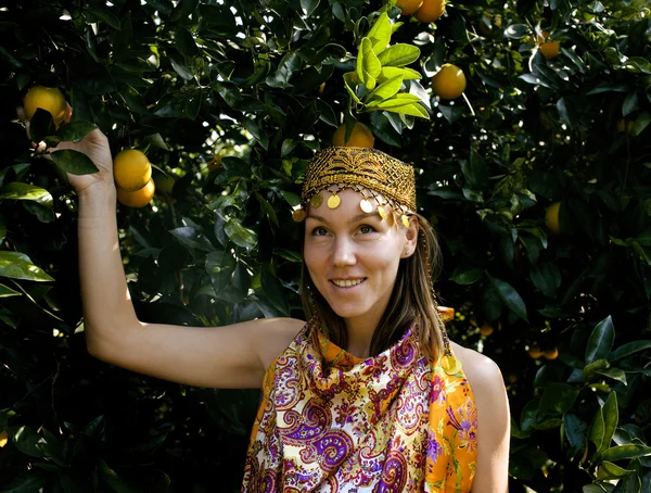 Pretty islam woman in orange grove smiling, real muslim girl