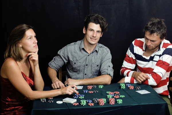 Young people playing poker off-line tournament betting call