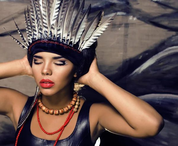 Young pretty woman with make up like red indian halloween outfit