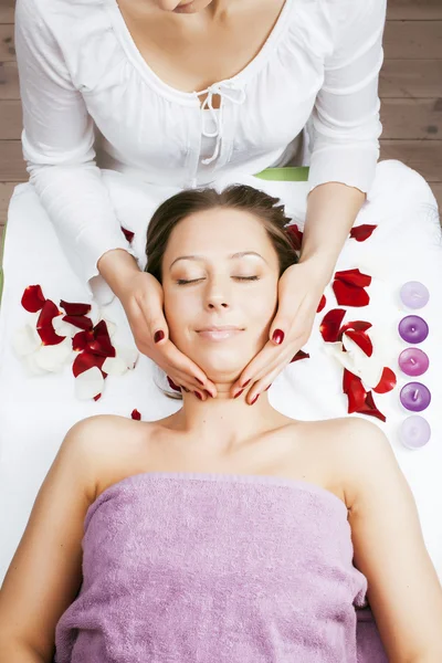 Stock photo attractive lady getting spa treatment in salon, massage doctor smiling care