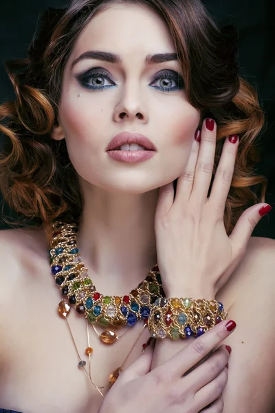 Beauty rich woman with luxury jewellery looks like mature close up, bright makeup