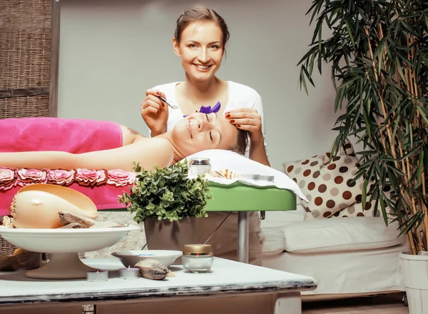 Stock photo attractive lady getting spa treatment in salon, massage doctor smiling care pretty