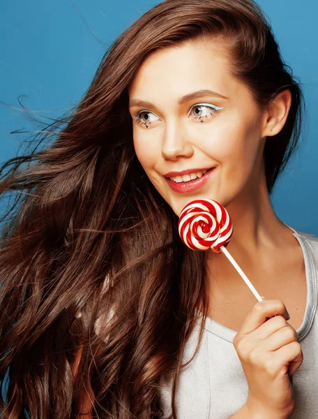 Young pretty adorable woman with candy close up like doll