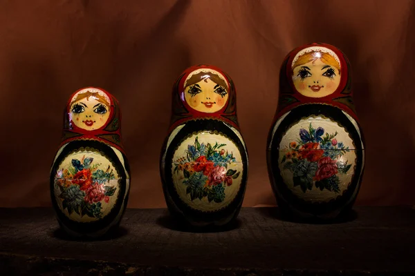 Russian dolls photographed on a wooden base