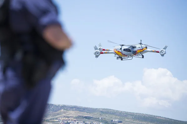 GRANADA,SPAIN - May 18: Aerobatic Spanish helicopter patrol (ASPA Patrol) perform at airshow (10 Aanniversary of Aspa Patrol in Granada) on May 18, 2014 in Granada ,Spain