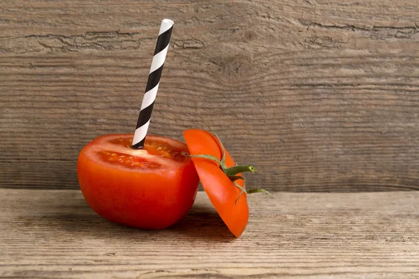 Tomato juice with straw