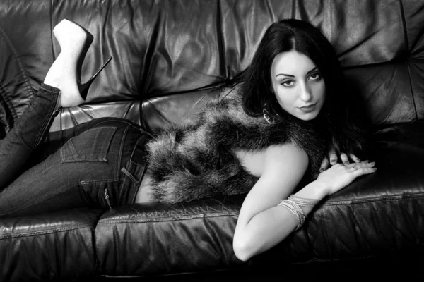 Brunette in fur on the couch