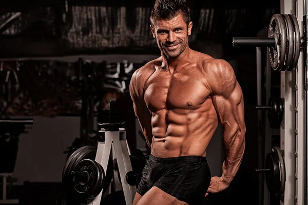 Bodybuilder posing in the gym