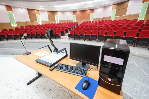 Microphone and computer in empty classroom