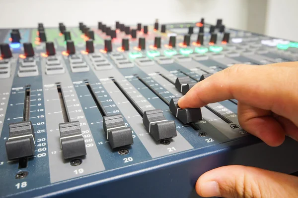 Hand using professional audio recording