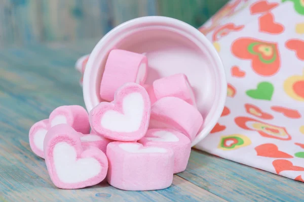 Colorful sweet marshmallow with sugar in a white-ware