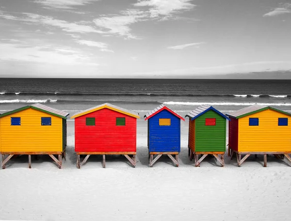The row of wooden brightly colored huts on Sunrise Beach. Atlantic ocean. Cape Town.  Muizenberg. South Africa.