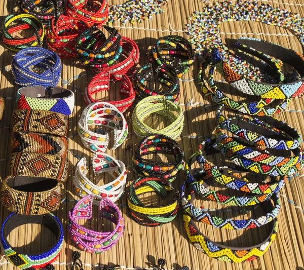 African unique traditional handmade colorful beads necklaces and bracelets. Local craft market in South Africa.