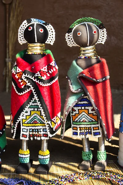 African unique traditional handmade colorful beads rag dolls. Local craft market in South Africa. Craftsmanship.