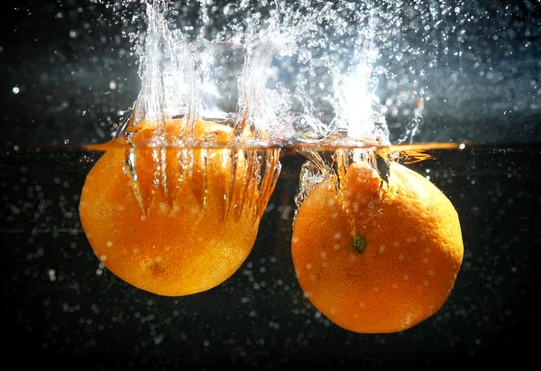 Orange splash  in water