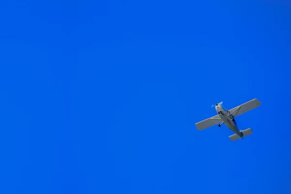 Small airplane and sky blue.