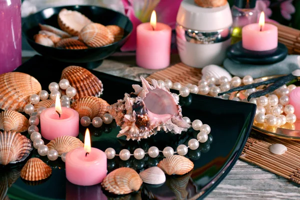 Spa decoration lilies and sea shells for relaxation