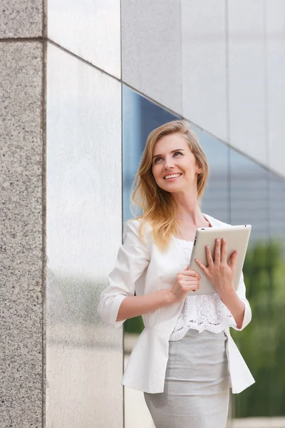 Beautiful woman using electronic tab