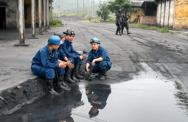 Quang Ninh, Vietnam, May 19, 2016 a group of workers Mao Khe coal mine, Quang Ninh province, Vietnam, minute breaks, shift change