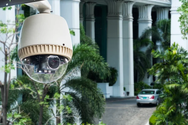 CCTV camera or surveillance operating on building entrance
