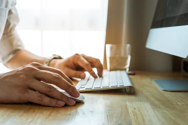 Man using desktop pc computer, mobile office concept