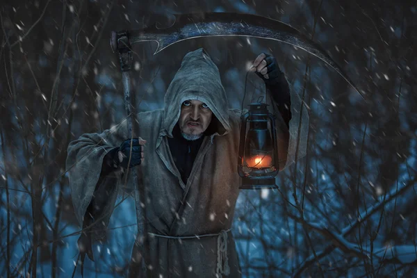 Close-up portrait of a grim reaper with scythe.