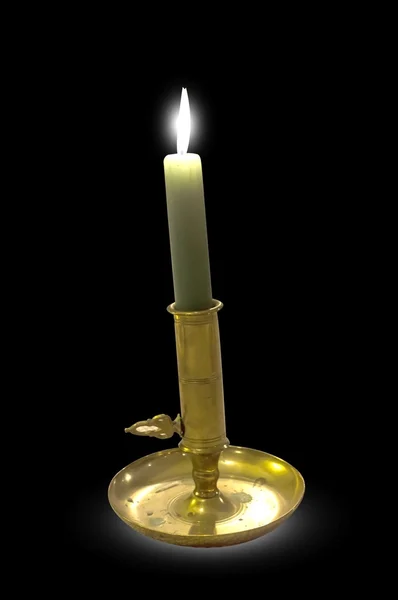 Candle in old fashioned candlestick holder