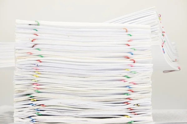 Pile of document with colorful paper clip on finance account