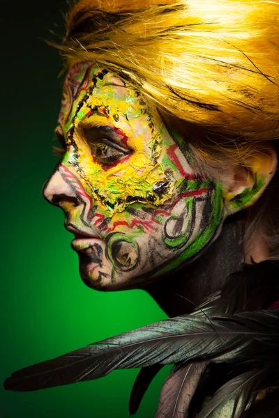 Woman with body and face art