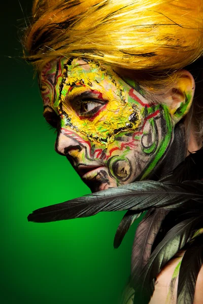 Woman with body and face art