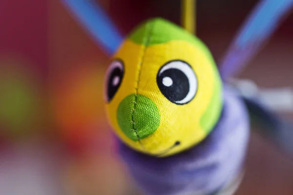 Little bee hanging above baby bed