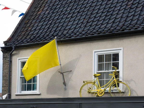 SOUTHWOLD, SUFFOLK/UK - JUNE 11 : Yellow Flag and Bicycle on a H
