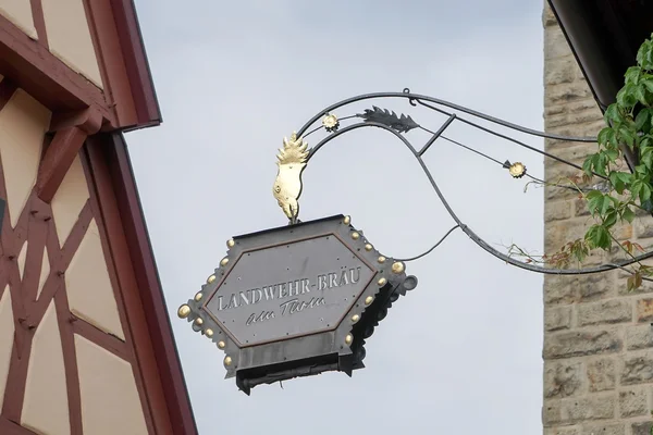 Ornate hanging sign for Landwehr-Brau in Rothenburg