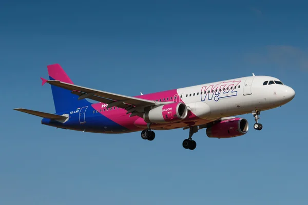 PRAGUE, CZECH REPUBLIC - AUGUST 30: Wizzair Airbus A320 lands at PRG Airport on August 30, 2016. Wizz Air is a Hungarian low-cost airline.