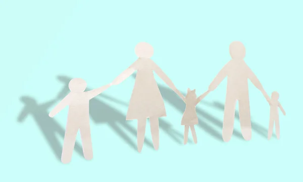 Paper family on blue background