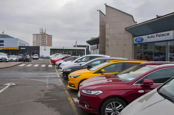 Cars parking in front of car store