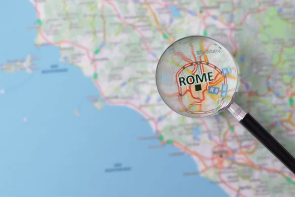Consultation with magnifying glass map of Rome